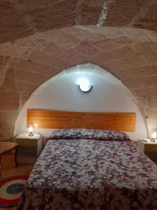 Postel nebo postele na pokoji v ubytování Dafne B&B