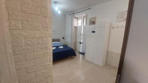 Ένα ή περισσότερα κρεβάτια σε δωμάτιο στο Baglieri appartament