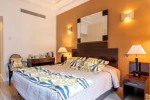 Postel nebo postele na pokoji v ubytování Hotel Le Meurice