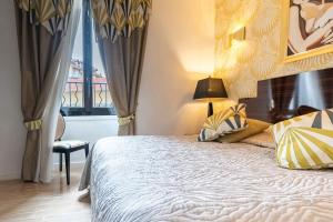 Postel nebo postele na pokoji v ubytování Hotel Le Meurice
