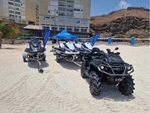 two motorcycles parked in the sand on a beach at Boa Mindelo Azul in Mindelo