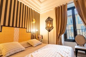 Postel nebo postele na pokoji v ubytování Hotel Le Meurice
