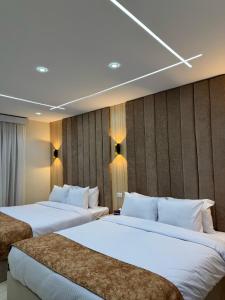 Postel nebo postele na pokoji v ubytování LE Grand Pyramids View & Suites