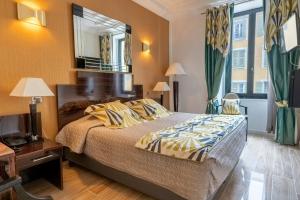Postel nebo postele na pokoji v ubytování Hotel Le Meurice