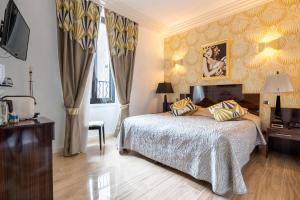 Postel nebo postele na pokoji v ubytování Hotel Le Meurice