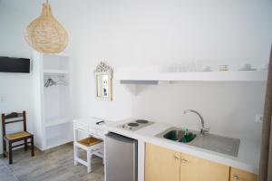 a kitchen with a sink and a counter top at Casa di Flora in Loutra