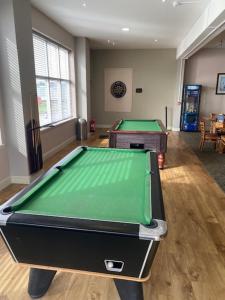 a room with a pool table in a room at Duffy's Den - Parkdean California Cliffs - Fulmar 45 in Scratby