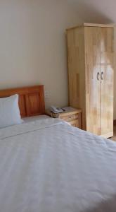 Postel nebo postele na pokoji v ubytování Cattleya