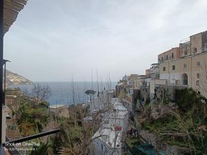 a view of a city with the ocean in the background at Regina Margherita in Positano