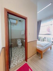 Postel nebo postele na pokoji v ubytování Cattleya