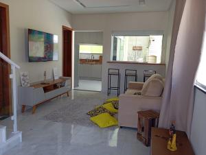 Posezení v ubytování Casa confortável in Arembepe