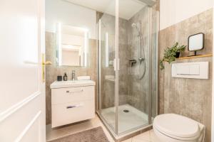 Koupelna v ubytování Inselliebe unter Reet + 34 fotografií