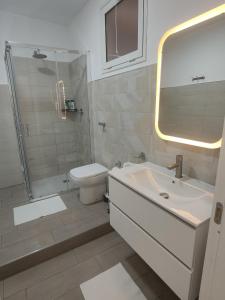 a bathroom with a sink and a shower and a toilet at Old Port la Marina - Luna in Mazara del Vallo