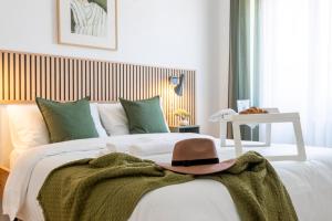 Postel nebo postele na pokoji v ubytování Yesclusive Apartment M4-Navigli Milan-Unipol Forum-Humanitas-Vodafone Village