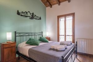 Giường trong phòng chung tại La Corte della Casera