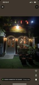 a restaurant at night with a sign on the front of it at Rosie Homestay in Ha Giang
