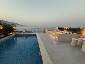 a swimming pool with a view of the water at 4BR Luxury Retreat & Prvt Pool in Sharm