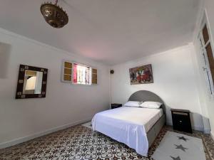 Ένα ή περισσότερα κρεβάτια σε δωμάτιο στο Mémoire des pierres, murmure des vagues +18 φωτογραφίες