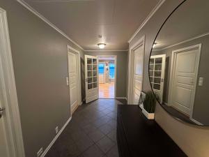 a hallway of a home with a large mirror at Leiligheit i Hornindal in Volda