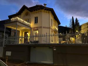 a white house with a fence in front of it at Principal Casa Pomar in Camprodon