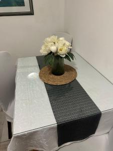 a vase of flowers sitting on a table at Old Town House Manosa Split in Split +9 photos