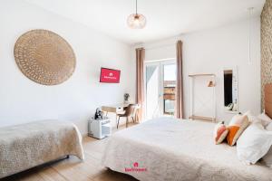 Postel nebo postele na pokoji v ubytování Barirooms - Carulli Suites + 28 fotografií