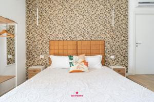 Postel nebo postele na pokoji v ubytování Barirooms - Carulli Suites