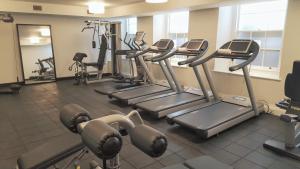 a gym with several tread machines in a room at The Gainsborough Bath Spa - Small Luxury Hotels of the World in Bath