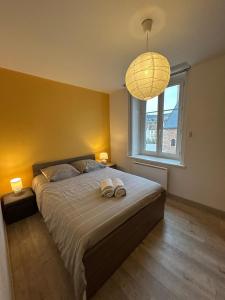 Ένα ή περισσότερα κρεβάτια σε δωμάτιο στο L'appart Rue Haute