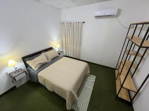 Ένα ή περισσότερα κρεβάτια σε δωμάτιο στο Departamento cómodo cerca de la costanera