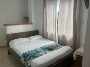 Letto o letti in una camera di Hotel Portal Guatapé