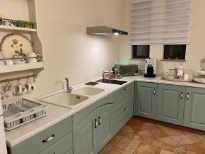 a kitchen with a sink and a counter top at casa bv in Calatabiano