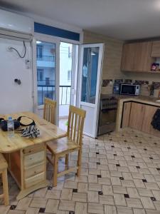 Kuchyň nebo kuchyňský kout v ubytování Petit appartement sympa