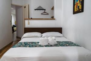 Letto o letti in una camera di Hotel Portal Guatapé