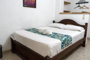 Letto o letti in una camera di Hotel Portal Guatapé