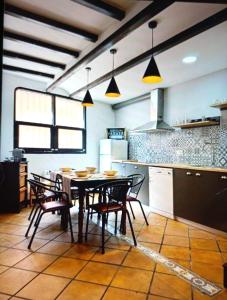 a kitchen with a table and chairs in a room at Casamanchega13j in Iniesta +16 photos