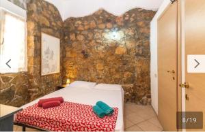 Ένα ή περισσότερα κρεβάτια σε δωμάτιο στο Cavalluccio Marino