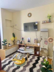 a living room with a couch and a table at Classy Condo in CDO in Cagayan de Oro