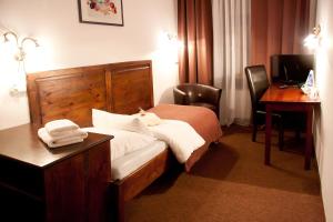 Posteľ alebo postele v izbe v ubytovaní Hotel Pod Orłem