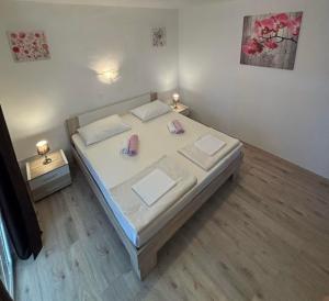 Ένα ή περισσότερα κρεβάτια σε δωμάτιο στο Apartments Lota