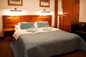 Posteľ alebo postele v izbe v ubytovaní Hotel Pod Orłem