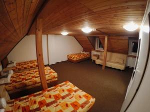 Postel nebo postele na pokoji v ubytování Hotel & Restaurant Adolfovský Dvůr