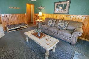 a living room with a couch and a coffee table at Lawn Lane B - #3383 in Estes Park