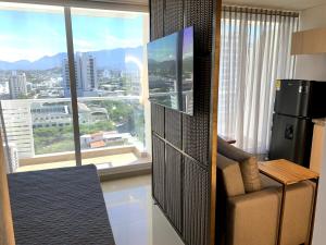 TV a/nebo společenská místnost v ubytování Exclusive Apartasuite El Encanto