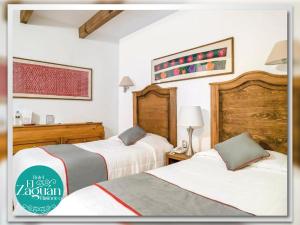 Postel nebo postele na pokoji v ubytování Hotel El Zaguán Histórico