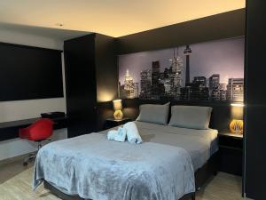 Postel nebo postele na pokoji v ubytování Loft aconchegante com varanda Campolim