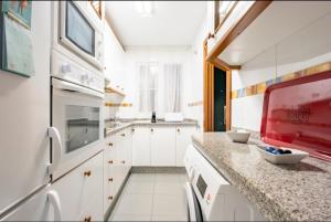 Kuchyňa alebo kuchynka v ubytovaní Flamingo Sol Home