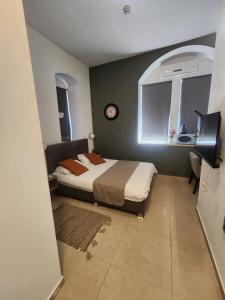 Postel nebo postele na pokoji v ubytování Ben Hillel Boutique Hotel + 11 fotografií