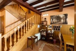 a room with a wooden staircase and a table at PR Badalada in Santiago de Compostela