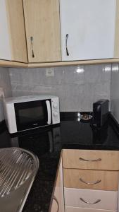 Kuchyňa alebo kuchynka v ubytovaní Ideal Holiday Apartment City Center
